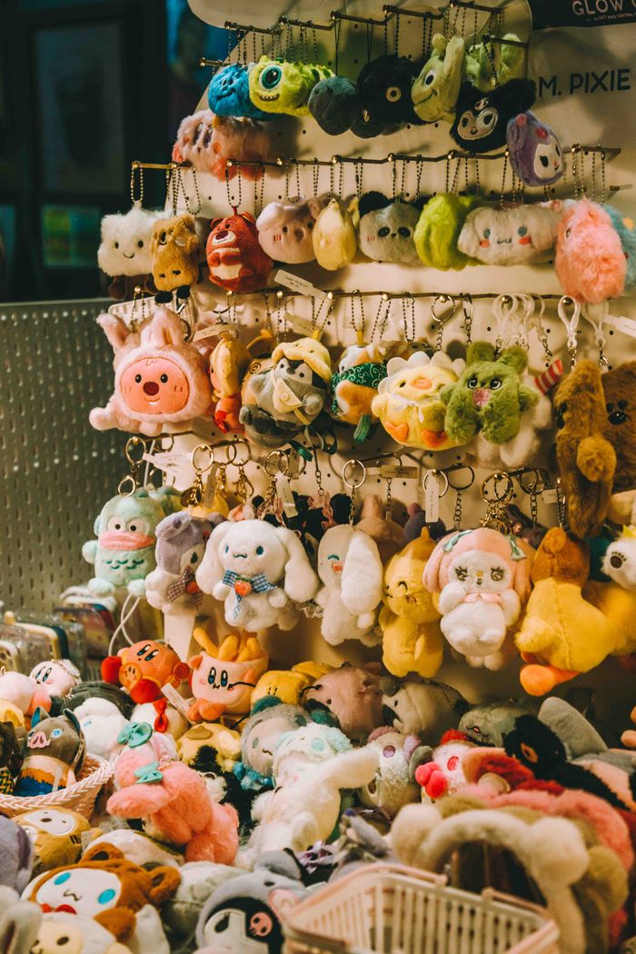 about-04 Vibrant array of plush toys and keychains on display in a Kuala Lumpur store.