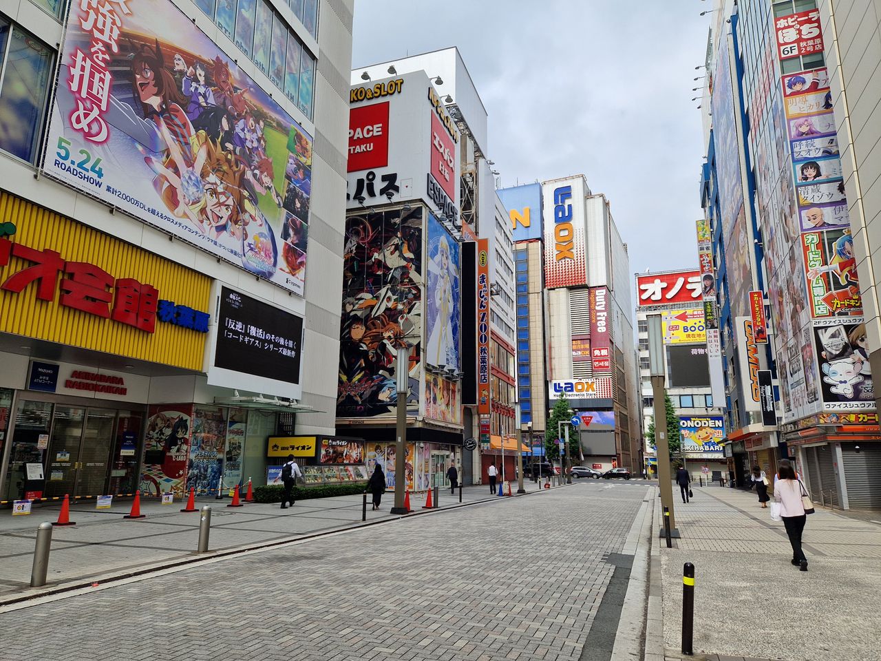 about-header Explore the bustling streets of Akihabara in Tokyo, Japan, adorned with vibrant anime and storefront signs.